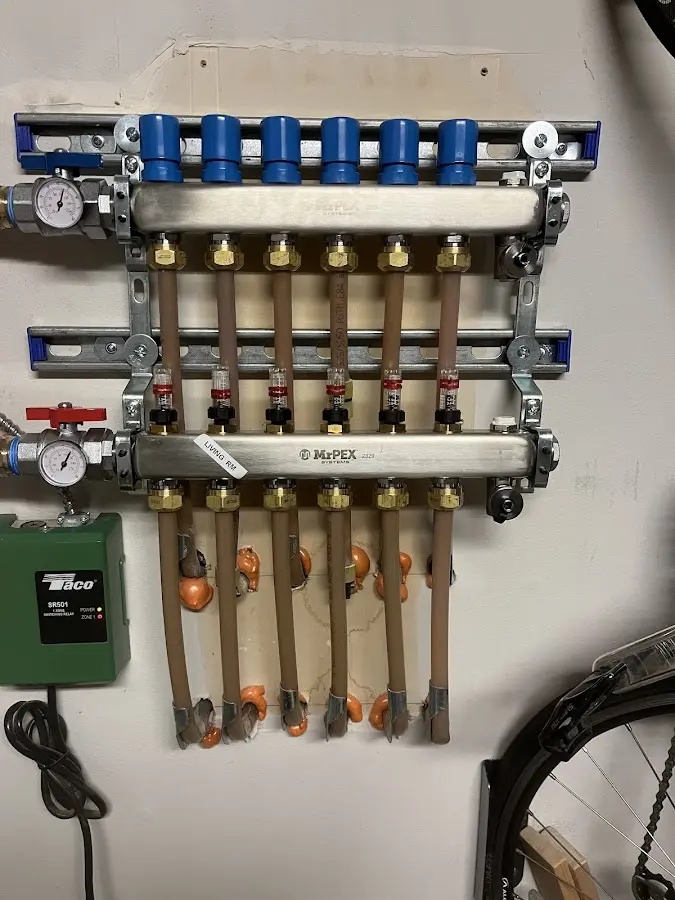 Plumber performing Water Heater Repair at a residential property in Belle Haven